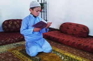 Kid reciting Holy Quran